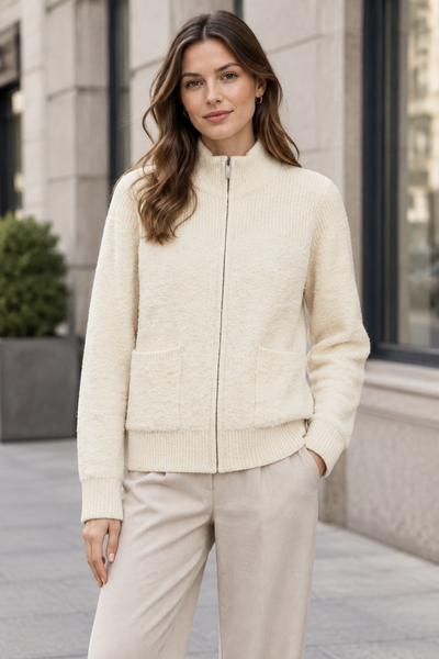 Long sleeve zipper-front cardigan worn by a female model in an urban setting