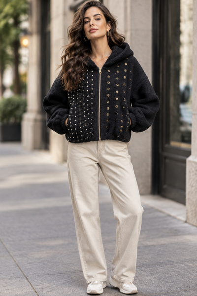 Female model wearing the black stud-front hooded jacket