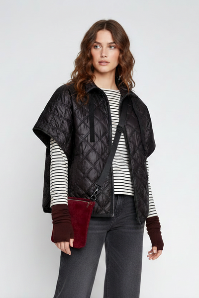 Black zipper-front quilted poncho on the alternate female model, landscape view